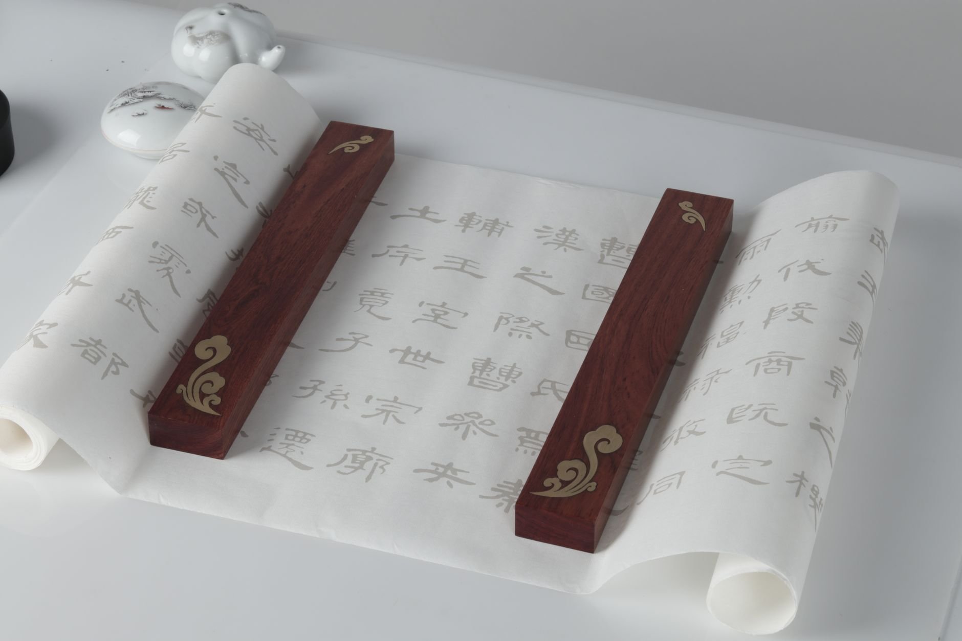 Roll of aged paper with handwritten script